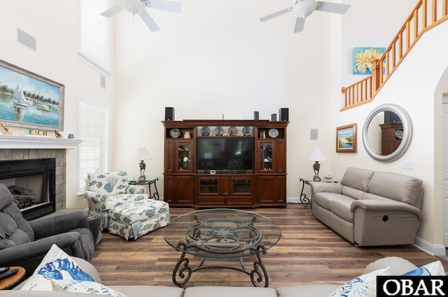 830 Hunt Club Dr Lot 387R, Corolla, NC 27927 - living room featuring ceiling fan, a fireplace, dark wood finished floors, and a towering ceiling