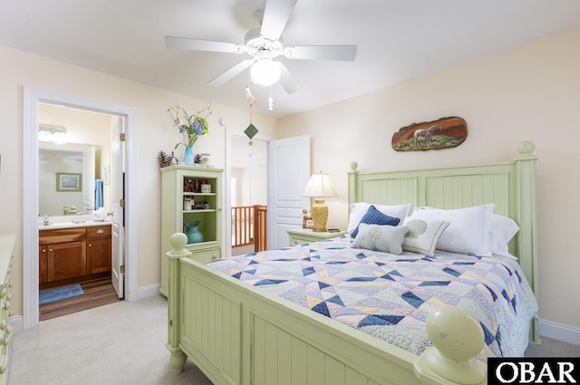 830 Hunt Club Dr Lot 387R, Corolla, NC 27927 - bedroom featuring baseboards, ceiling fan, connected bathroom, and light colored carpet