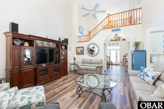 830 Hunt Club Dr Lot 387R, Corolla, NC 27927 - living room featuring arched walkways, a high ceiling, ceiling fan, and wood finished floors