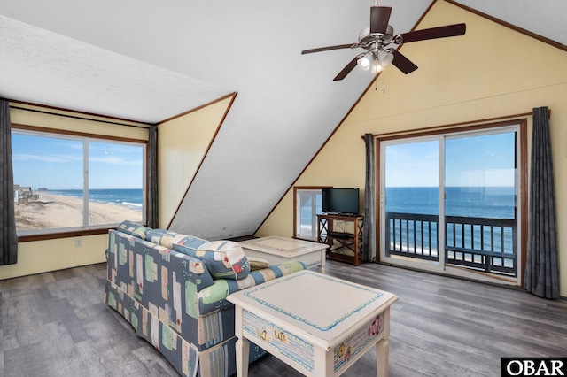 bedroom featuring lofted ceiling, access to outside, a ceiling fan, and wood finished floors