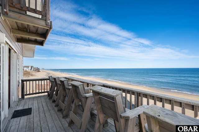 exterior space featuring a water view and a view of the beach