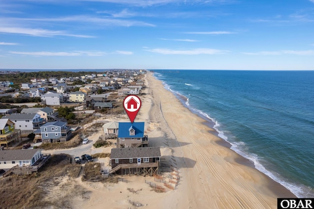 bird's eye view featuring a water view, a residential view, and a beach view