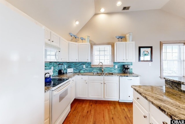 25224 Mac Oca Dr Lot 24, Waves, NC 27982 - kitchen featuring white appliances, backsplash, light wood-style flooring, white cabinetry, and recessed lighting