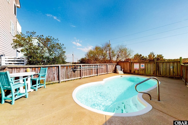 25224 Mac Oca Dr Lot 24, Waves, NC 27982 - view of pool featuring a fenced backyard and a patio area