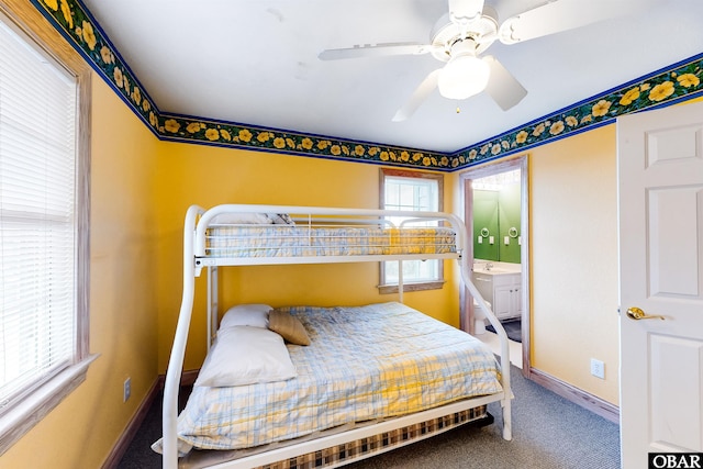 25224 Mac Oca Dr Lot 24, Waves, NC 27982 - carpeted bedroom featuring baseboards and ensuite bath