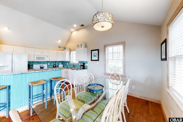 25224 Mac Oca Dr Lot 24, Waves, NC 27982 - dining space featuring lofted ceiling, plenty of natural light, light wood-style floors, and recessed lighting