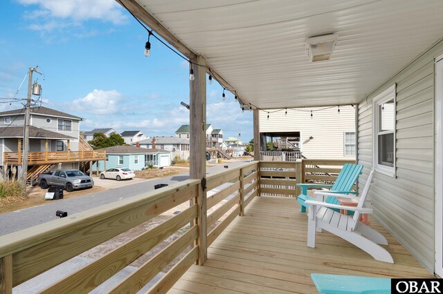 balcony with covered porch and a residential view