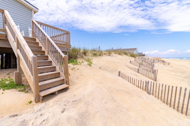 view of yard with stairs and fence