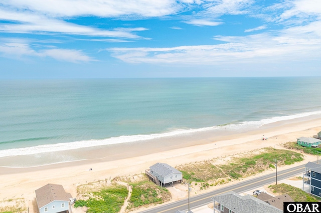 property view of water featuring a beach view