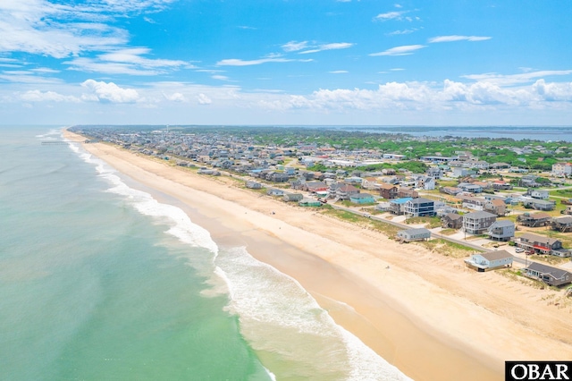 drone / aerial view with a view of the beach and a water view