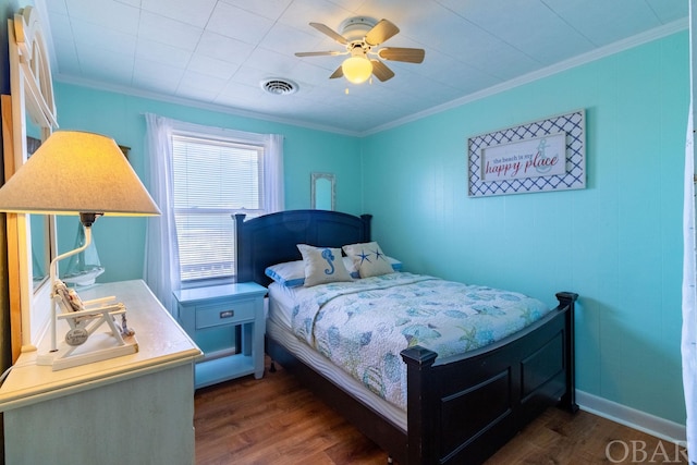 bedroom featuring ornamental molding, dark wood-style flooring, visible vents, and ceiling fan