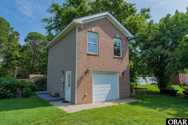 118 Neversail Way Lot 17, Coinjock, NC 27923 - view of front of house with a garage, a front lawn, and brick siding