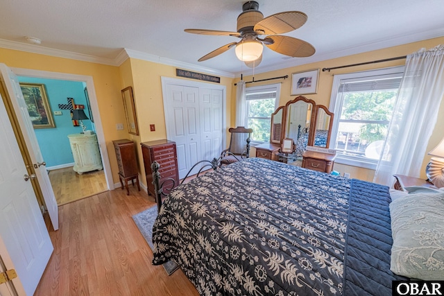 118 Neversail Way Lot 17, Coinjock, NC 27923 - bedroom with light wood-style floors, crown molding, a ceiling fan, and a closet