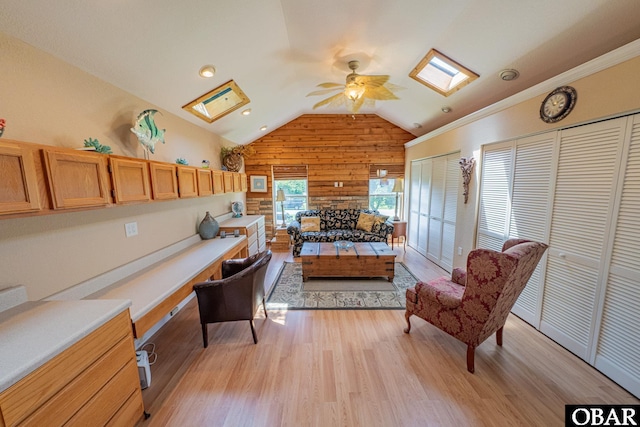 118 Neversail Way Lot 17, Coinjock, NC 27923 - living area with a skylight, ceiling fan, wooden walls, lofted ceiling, and light wood-style flooring