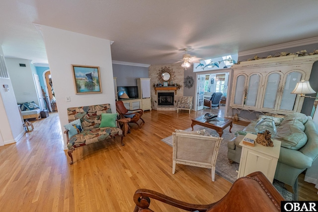 118 Neversail Way Lot 17, Coinjock, NC 27923 - living area featuring ceiling fan, light wood finished floors, a large fireplace, and crown molding