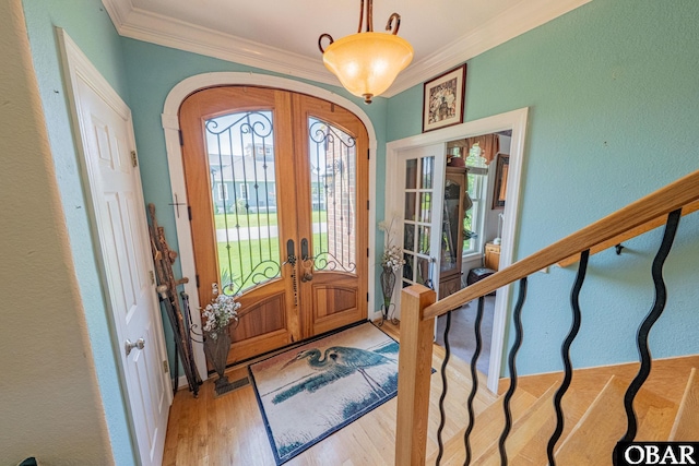 118 Neversail Way Lot 17, Coinjock, NC 27923 - foyer featuring french doors, wood finished floors, ornamental molding, a textured wall, and arched walkways