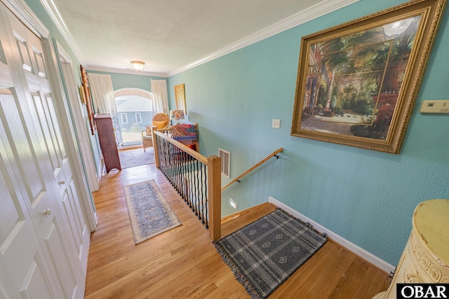 118 Neversail Way Lot 17, Coinjock, NC 27923 - hall with an upstairs landing, light wood finished floors, and ornamental molding