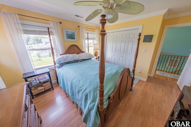118 Neversail Way Lot 17, Coinjock, NC 27923 - bedroom featuring crown molding, light wood-style floors, a ceiling fan, and a closet