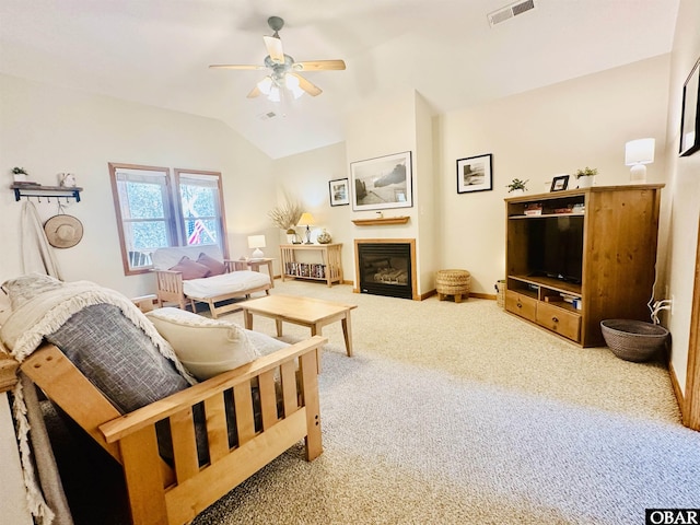 2018 Sea Horse Rd Lot # 67, Corolla, NC 27927 - carpeted living room featuring vaulted ceiling, a ceiling fan, and a glass covered fireplace