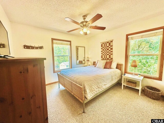2018 Sea Horse Rd Lot # 67, Corolla, NC 27927 - bedroom with a textured ceiling, a ceiling fan, and light carpet