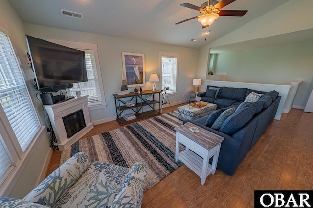 26223A Bluebeard Rd Lot 88, Salvo, NC 27972 - living room featuring wood finished floors, healthy amount of natural light, baseboards, vaulted ceiling, and a ceiling fan