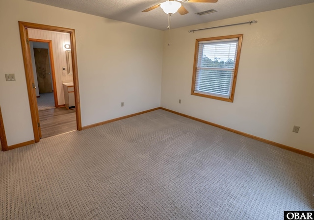 50078 Live Oak Ln Lot # 2, Frisco, NC 27936 - carpeted spare room with visible vents, ceiling fan, a textured ceiling, and baseboards