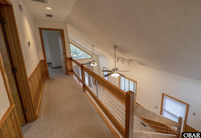 50078 Live Oak Ln Lot # 2, Frisco, NC 27936 - hall featuring light colored carpet, a wainscoted wall, an upstairs landing, visible vents, and vaulted ceiling