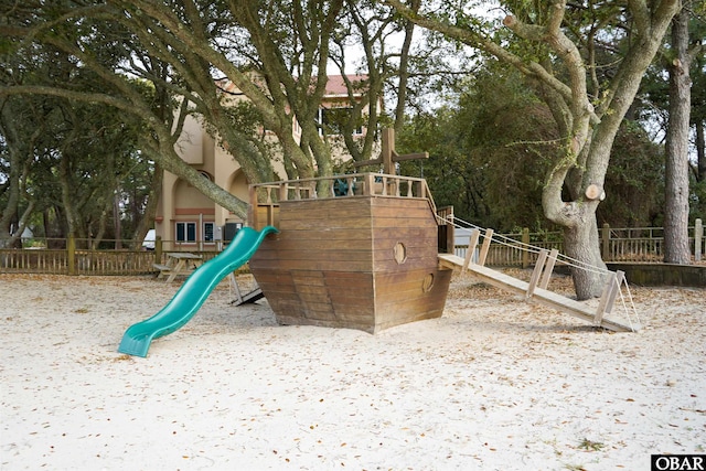 view of playground featuring fence