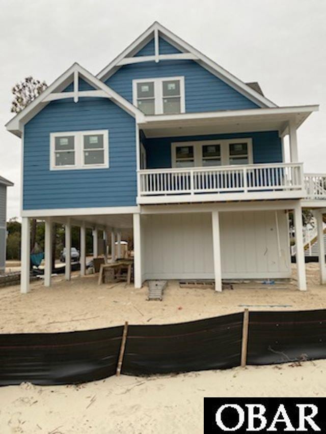 rear view of house featuring a carport