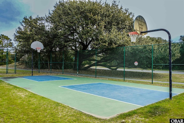view of sport court featuring community basketball court and fence