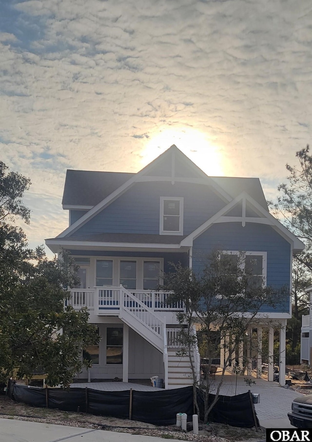 view of front of house with stairs and a porch