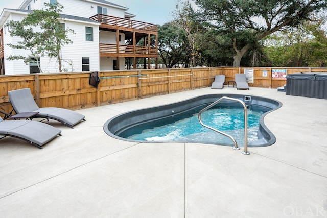 view of pool featuring a patio area, fence, and a fenced in pool