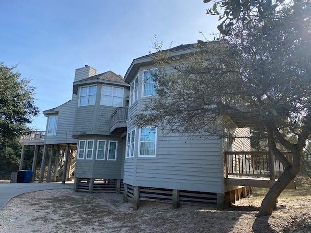 125 Foresail Ct Lot 37, Duck, NC 27949 - back of house with a chimney and a deck