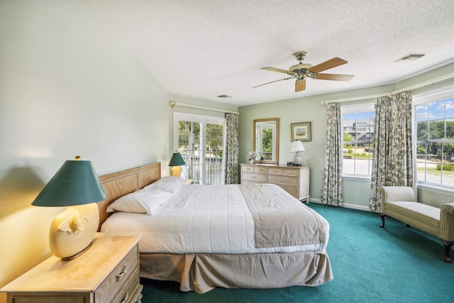 125 Foresail Ct Lot 37, Duck, NC 27949 - bedroom with dark carpet, a textured ceiling, access to outside, baseboards, and ceiling fan