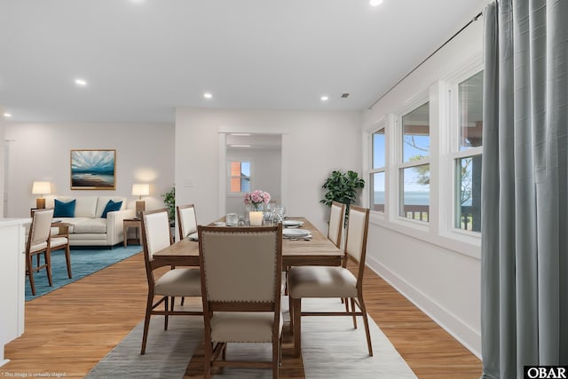 dining space featuring a wealth of natural light, recessed lighting, and light wood-style flooring