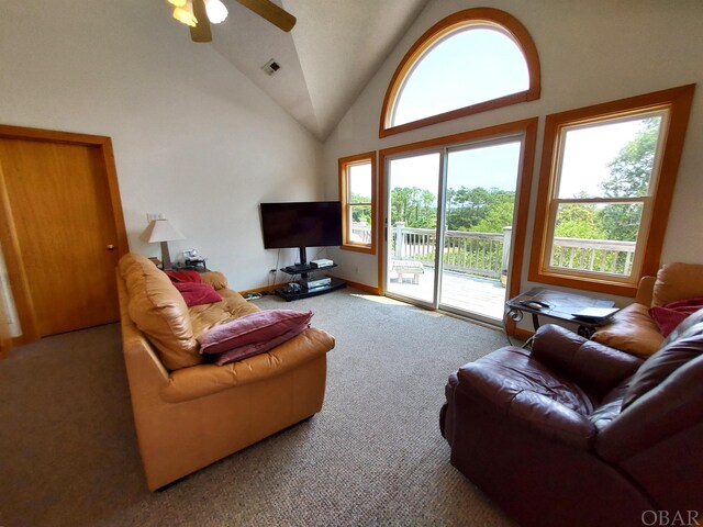 living room with high vaulted ceiling, carpet flooring, visible vents, and a ceiling fan