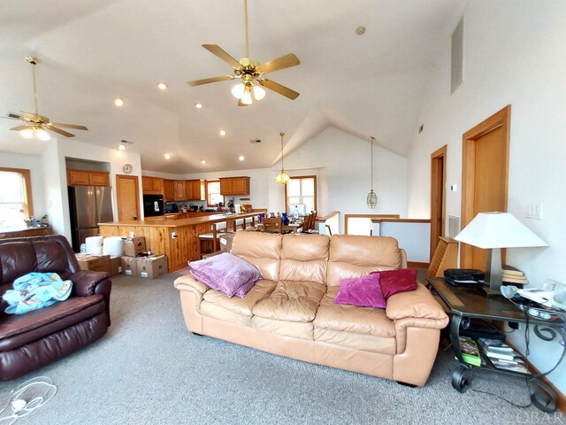 living area with recessed lighting, light colored carpet, vaulted ceiling, and ceiling fan