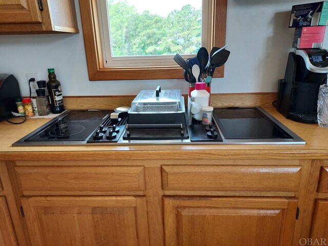 kitchen with light countertops and brown cabinets