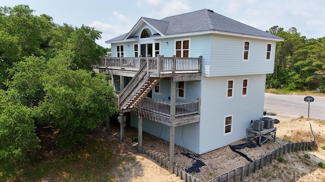 3111 Atlantic View Ct Lot 17, Nags Head, NC 27959 - rear view of property featuring a shingled roof, stairway, a wooden deck, and central air condition unit