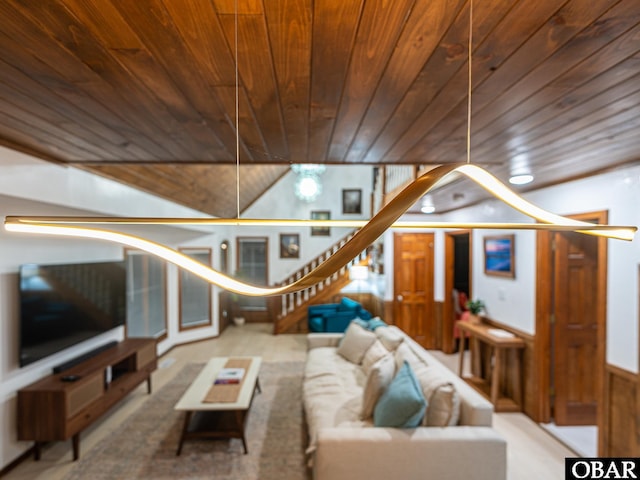 living area with wooden ceiling and stairs