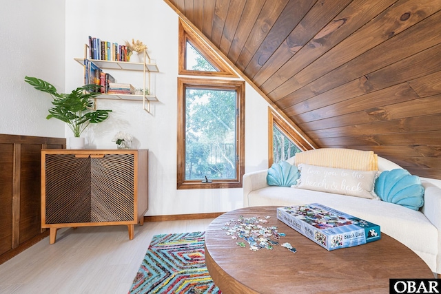 bedroom with light wood-type flooring, wooden ceiling, and vaulted ceiling