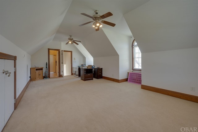 additional living space with baseboards, lofted ceiling, and light colored carpet