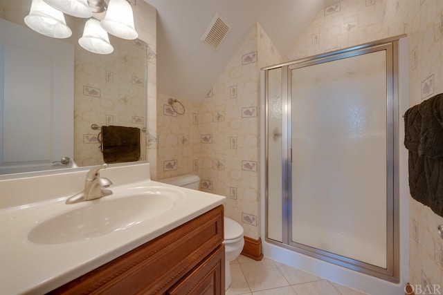 bathroom with visible vents, lofted ceiling, toilet, tile patterned flooring, and a shower stall