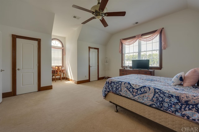 bedroom with light colored carpet, lofted ceiling, visible vents, and baseboards