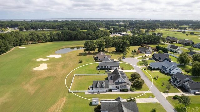 aerial view featuring a residential view, view of golf course, and a water view