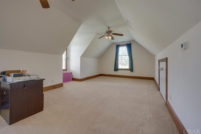 bonus room featuring a ceiling fan, light carpet, vaulted ceiling, and baseboards