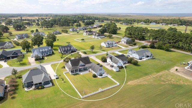 birds eye view of property with a residential view