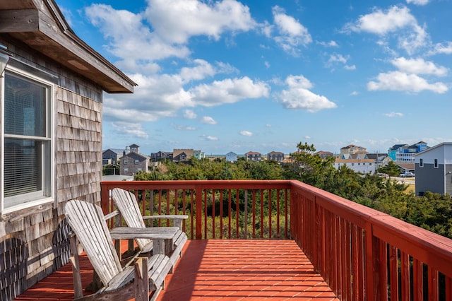 wooden deck featuring a residential view