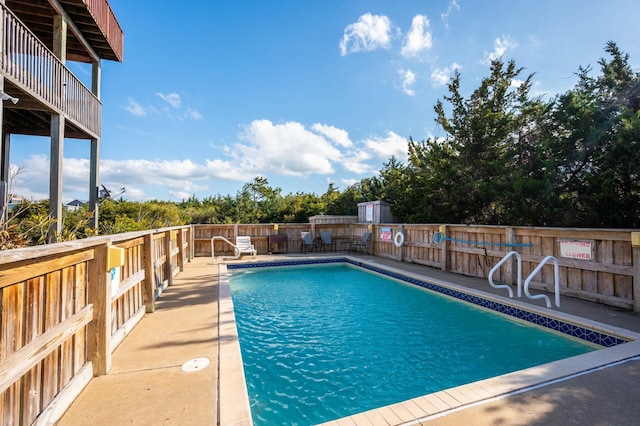 view of swimming pool featuring fence private yard and a fenced in pool