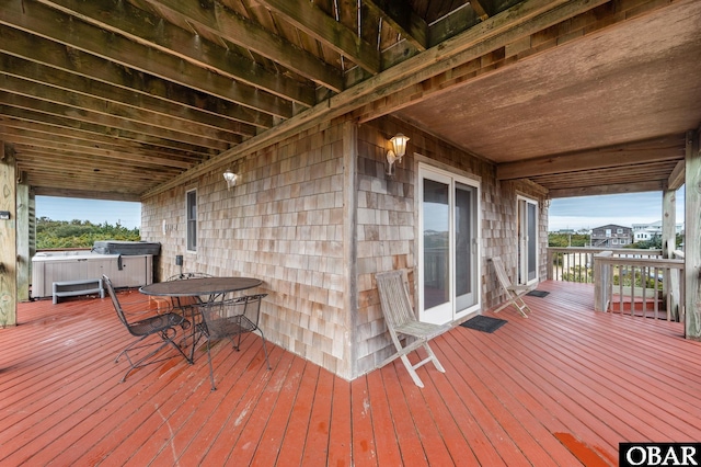 deck featuring a hot tub